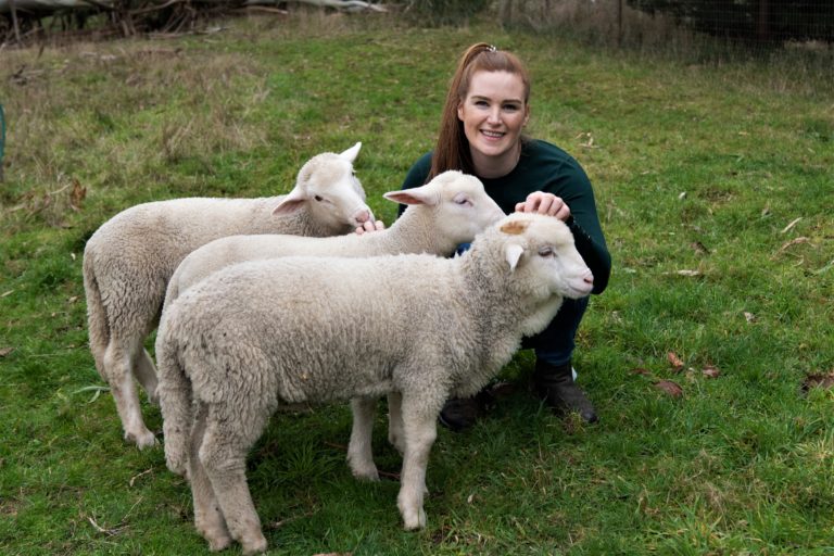 person with our 3 rescue lambs she adopted